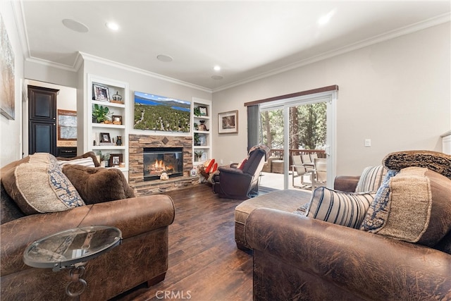 living room featuring a fireplace, built in features, dark hardwood / wood-style floors, and ornamental molding