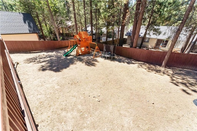 view of jungle gym with a trampoline