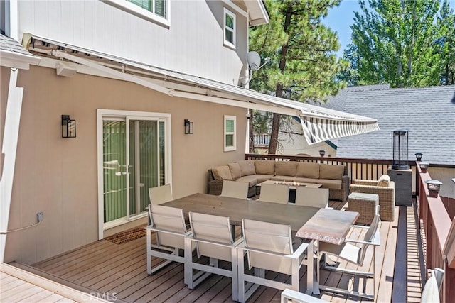 wooden terrace with outdoor lounge area