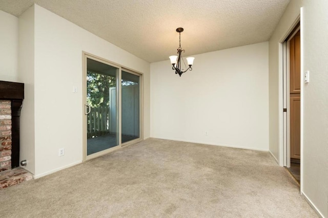 interior space with a textured ceiling, carpet, and a notable chandelier