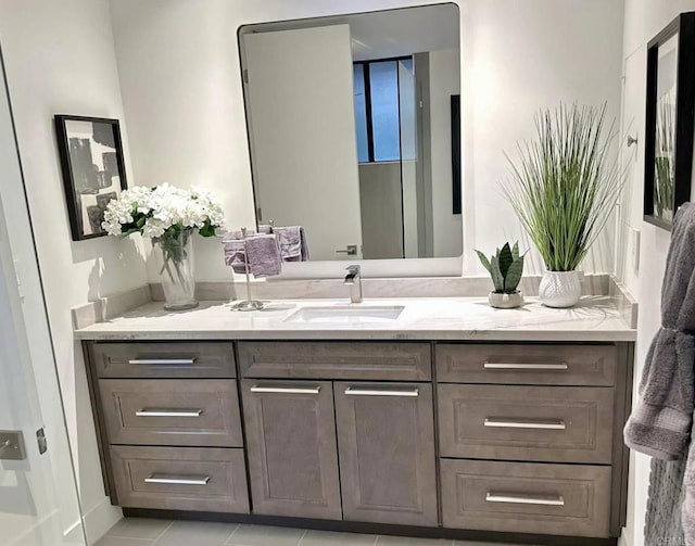 bathroom featuring tile patterned floors and vanity