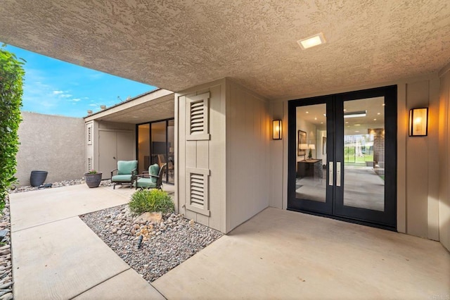 entrance to property featuring a patio area