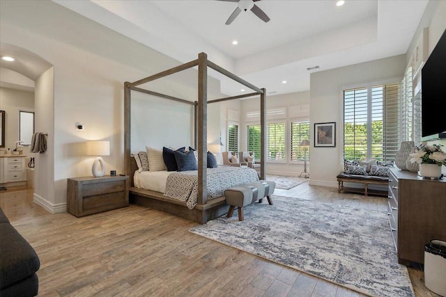 bedroom featuring ceiling fan and light hardwood / wood-style flooring