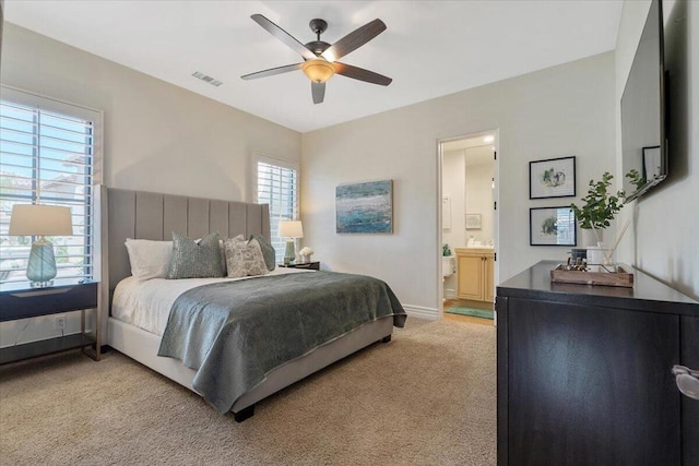 carpeted bedroom featuring ceiling fan and connected bathroom