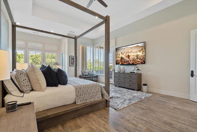 bedroom featuring ceiling fan and wood-type flooring