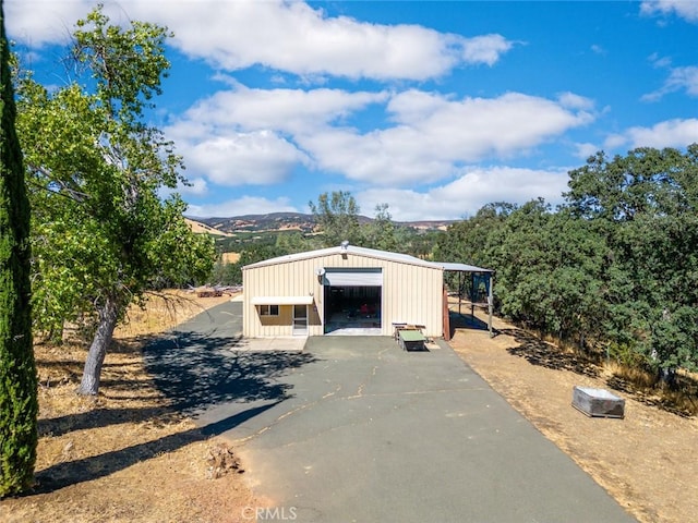 exterior space featuring a mountain view and a garage