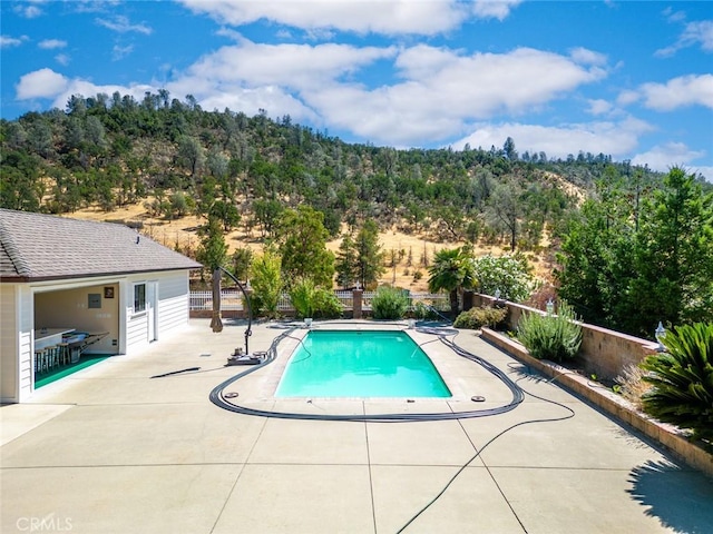 view of pool featuring a patio area