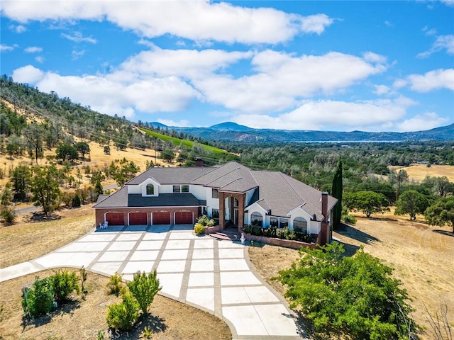 view of front of home featuring a mountain view