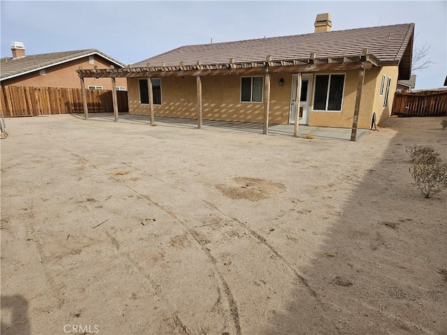 rear view of property featuring a patio area