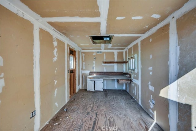 kitchen featuring white cabinets and hardwood / wood-style flooring