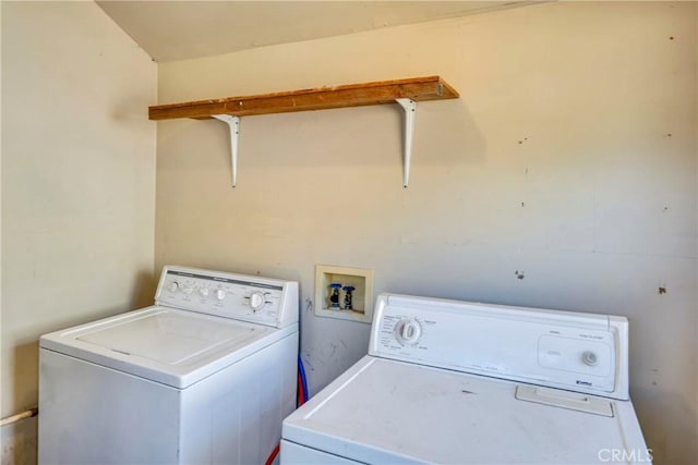 clothes washing area with washer and dryer