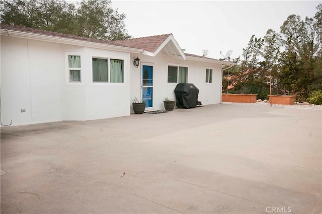 back of property with a patio area