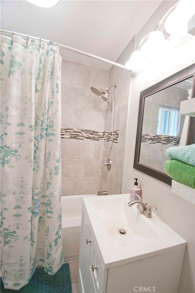 bathroom featuring vanity and shower / bath combo