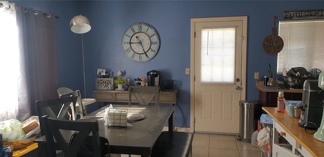 dining space with light tile patterned flooring