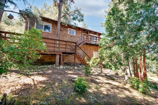 rear view of house with a deck