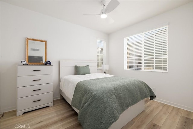 bedroom featuring ceiling fan and light hardwood / wood-style floors