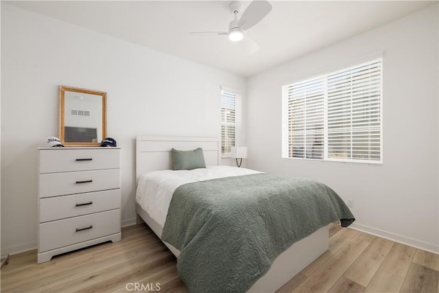 32879 Brunello Way, Temecula, CA 92591 - bedroom with light wood finished floors and a ceiling fan