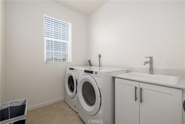 laundry room featuring washer and dryer, light tile patterned floors, sink, and cabinets