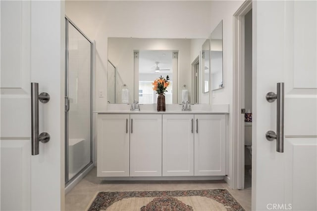 32879 Brunello Way, Temecula, CA 92591 - bathroom with double vanity, a shower stall, and ceiling fan