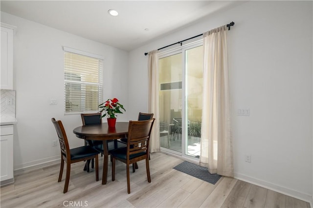 dining area with light wood-type flooring