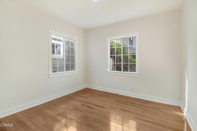 spare room featuring hardwood / wood-style flooring