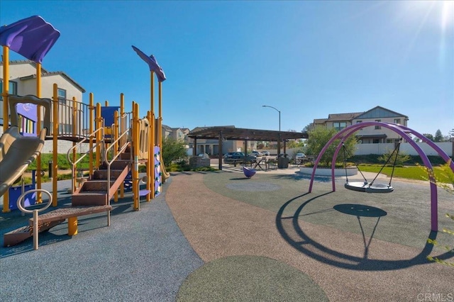 view of jungle gym featuring a pergola