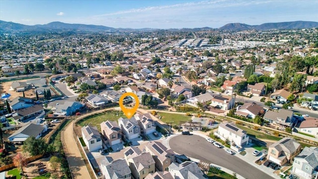 birds eye view of property featuring a mountain view