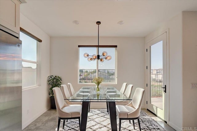 dining room with a healthy amount of sunlight and a chandelier