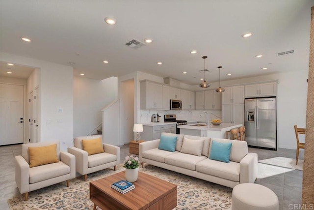 living room featuring sink