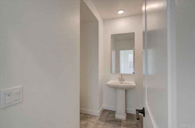 bathroom with tile patterned flooring and sink