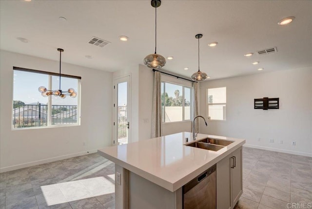 kitchen featuring stainless steel dishwasher, sink, a center island with sink, a chandelier, and hanging light fixtures