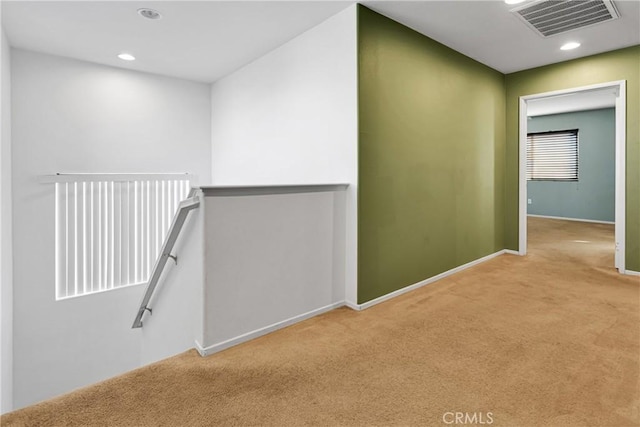 corridor with light colored carpet