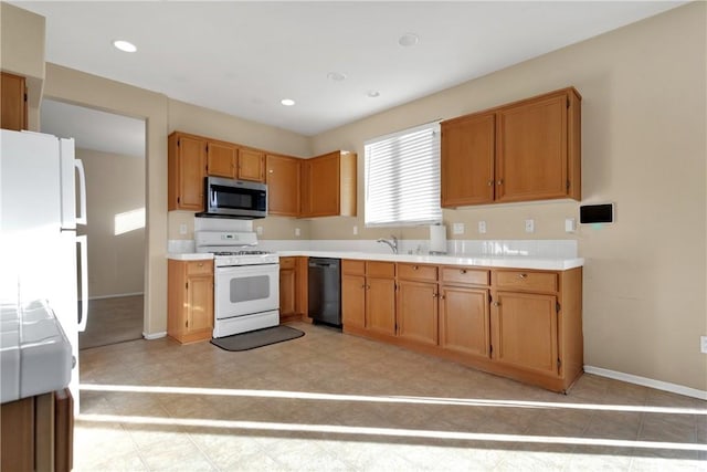 kitchen with sink and white appliances