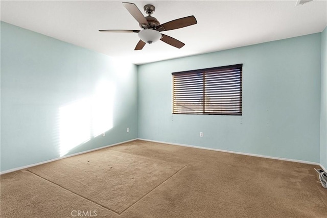 empty room featuring ceiling fan and carpet flooring