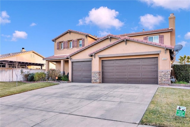 view of front of house featuring a front yard and a garage