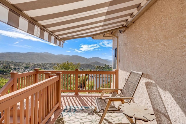 balcony featuring a mountain view