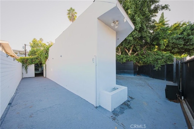 view of property exterior featuring a patio area