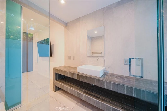 bathroom featuring tile patterned flooring and vanity