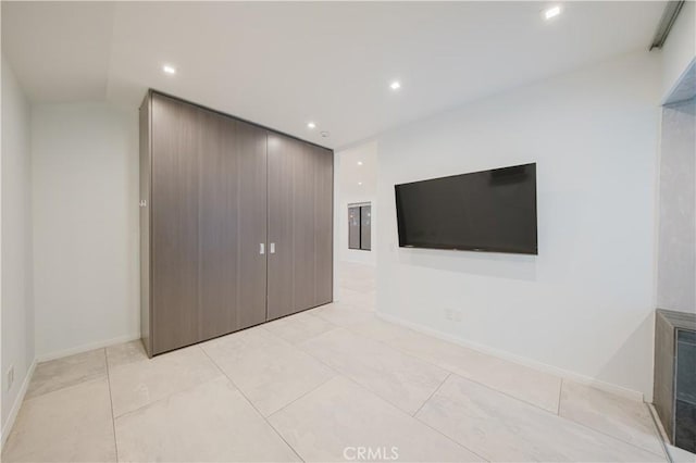 unfurnished bedroom with light tile patterned floors