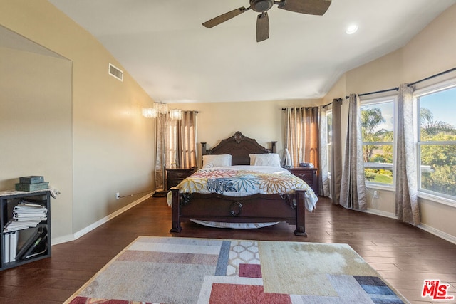 bedroom featuring ceiling fan, dark hardwood / wood-style flooring, and vaulted ceiling