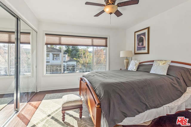 bedroom with hardwood / wood-style floors and ceiling fan