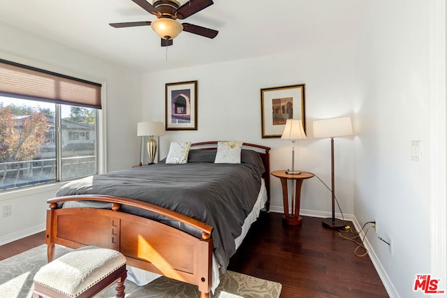 bedroom with ceiling fan and dark hardwood / wood-style flooring