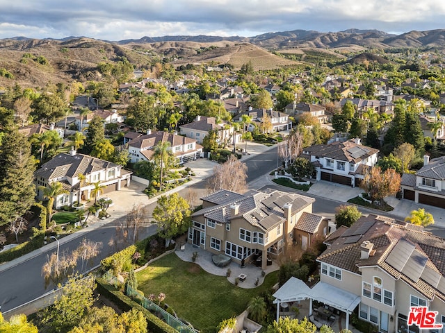 birds eye view of property featuring a mountain view