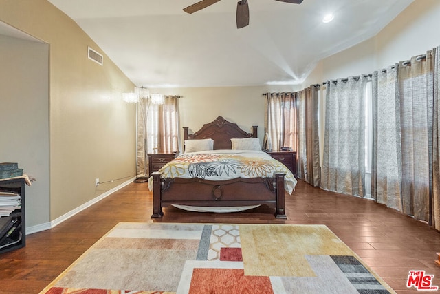 bedroom featuring hardwood / wood-style floors, ceiling fan, and lofted ceiling