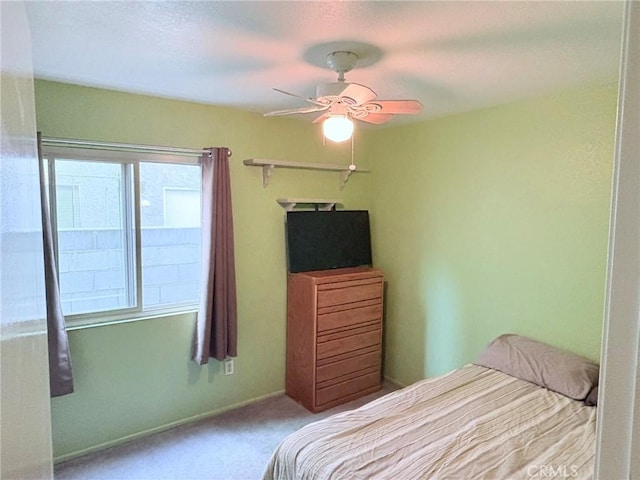 unfurnished bedroom with ceiling fan and carpet flooring