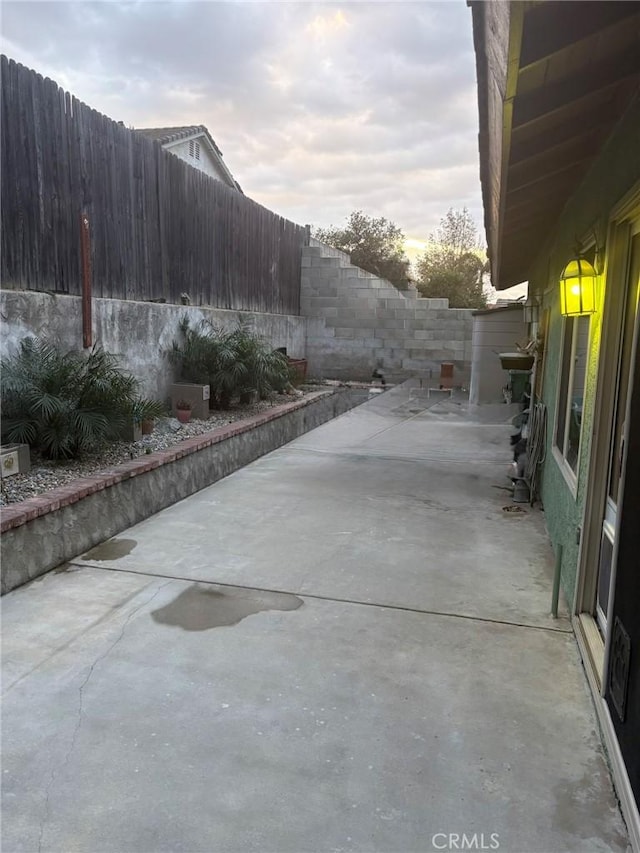 view of property exterior featuring a patio area