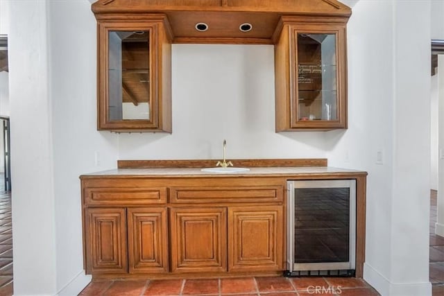 bar with wine cooler and sink