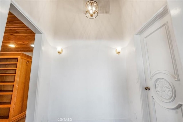 stairs with wooden ceiling