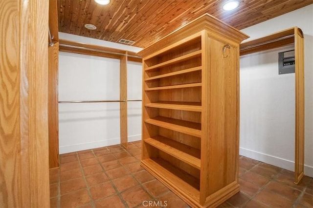 walk in closet with tile patterned floors