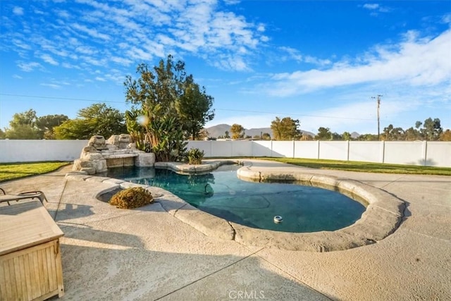 view of swimming pool with a patio area